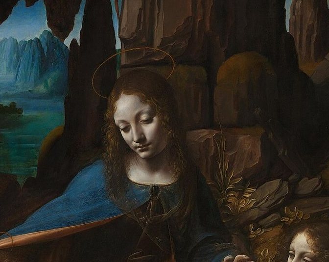 Detail of the Virgin's face and shoulders against a rocky grotto; her features turn into shadow with no visible outline.